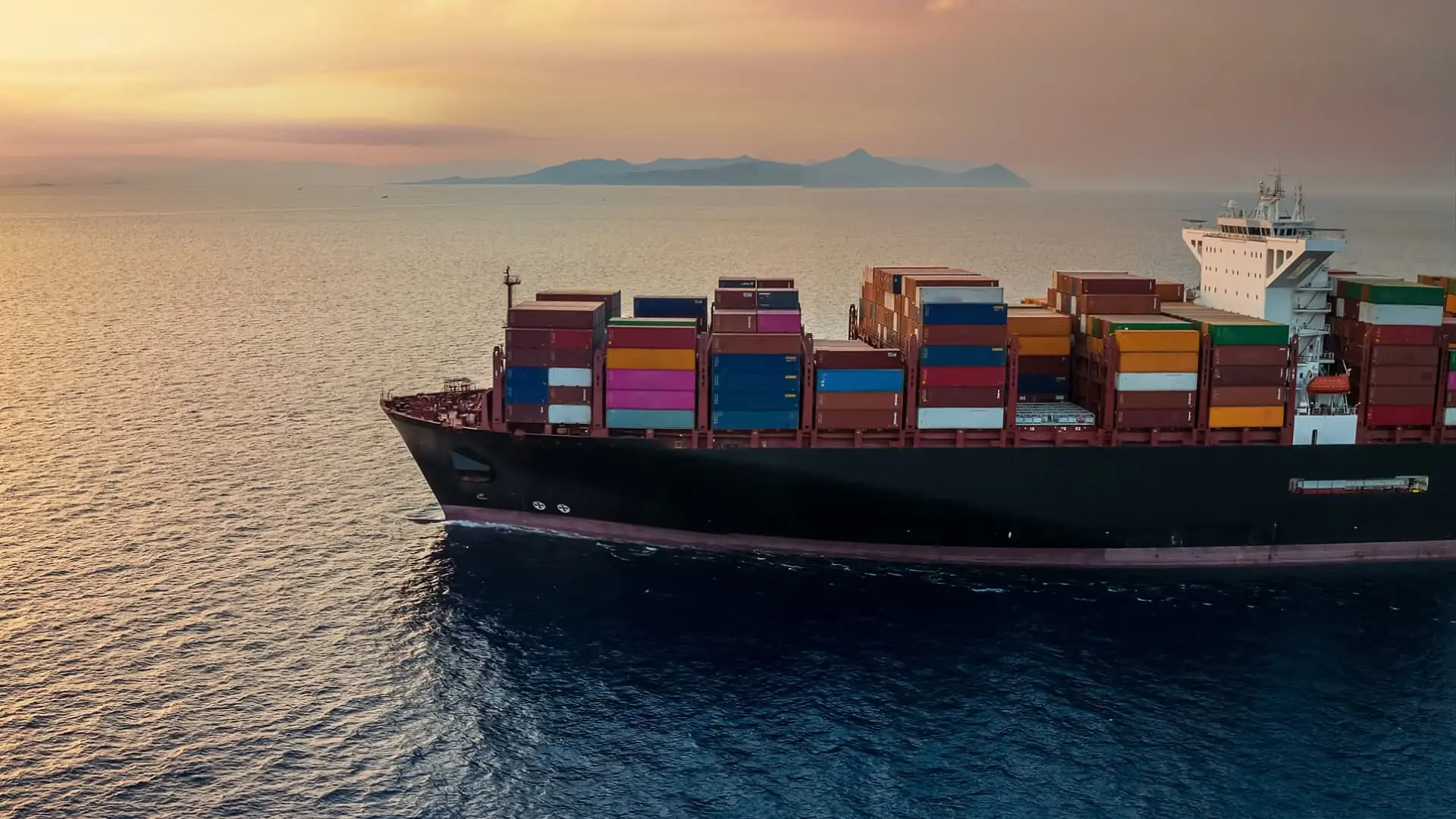 Cargo ship at sunset